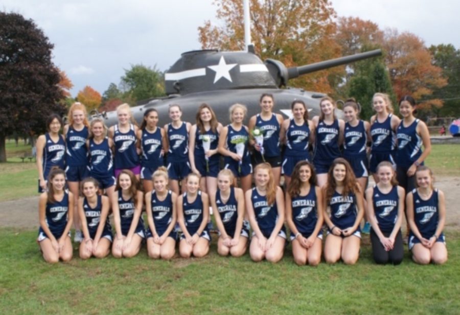 The cross country varsity and junior varsity girls pose for a picture at Patton Park.
