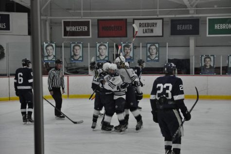 Celebrations after senior Will Hogan scores the first goal of the game.