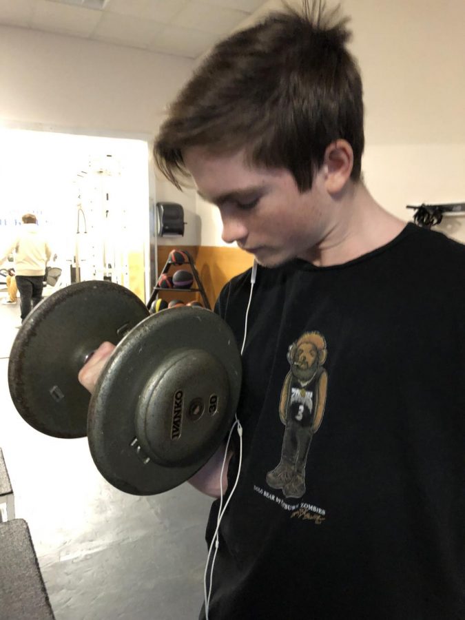 Herbie Collins, sophomore, weight lifting in the high school workout room