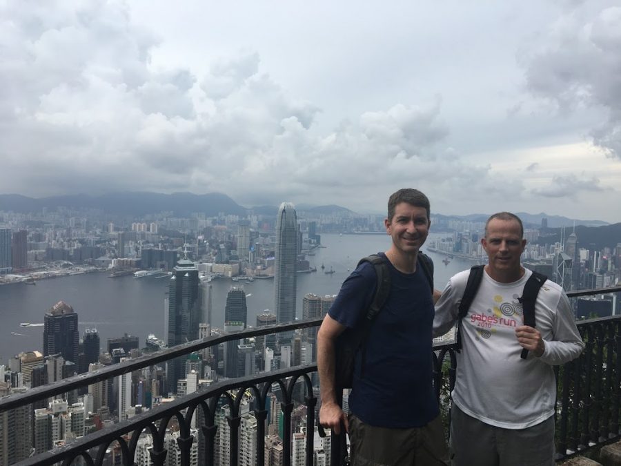 Mr. Campbell and Mr. Hickey standing at Victoria Peak in Hong Kong. 