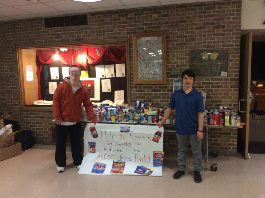 Timothy LaBudde (21) and Max Vanderwilen (21) in front of the donations they gathered
