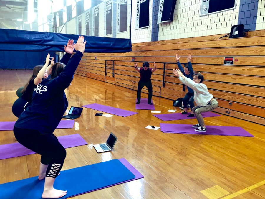 Students practicing for Community Yoga/Pilates sessions