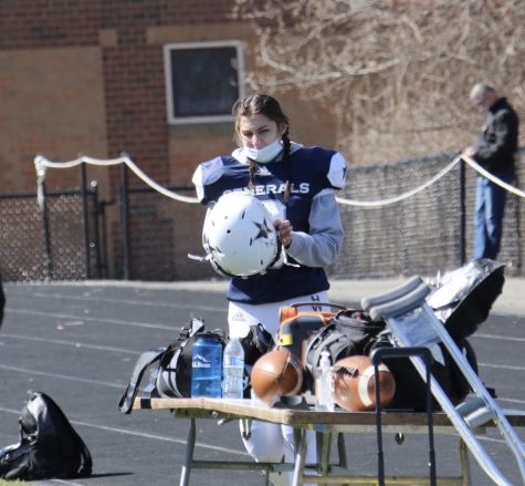 Generals football player Christa Coffey, Class of 2022, prepares to enter the game.  Photograph courtesy of Mr. Leonard Dolan.