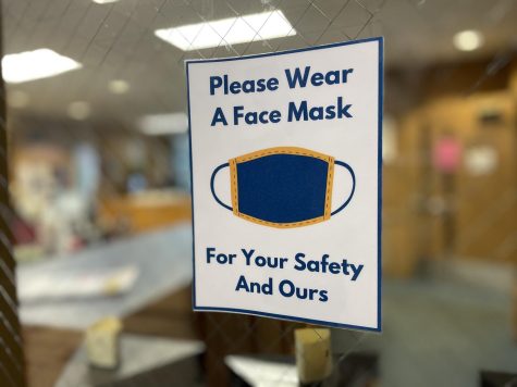 Signs reminding students to mask up remain a common sight in the Regional. 