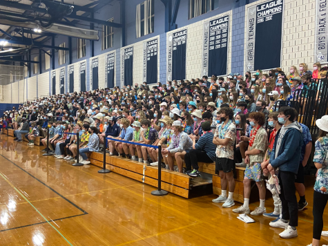 Students support the girls volleyball team in their elite eight matchup against Advanced Math and Science Academy.