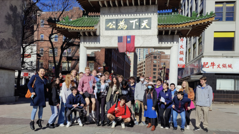 Senior Mandarin students pose in front of Boston Chinatown gate.