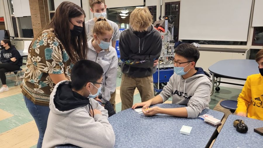 Eugene Ahn performs magic at an open house in 2021. 