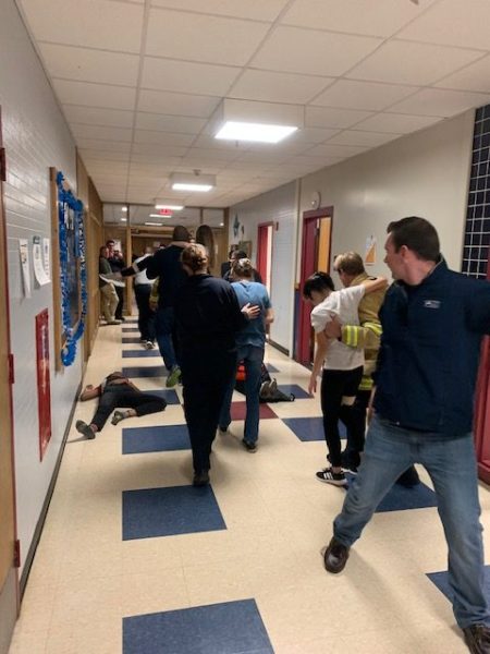 In 2020, Hamilton-Wenham Police and Firefighters took part in a specialized safety protocol drill. All students were volunteer actors from HWRHS.