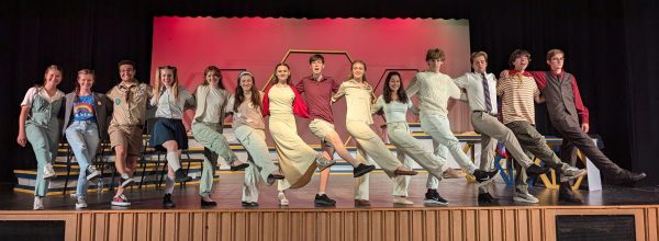 Cast from The 25th Annual Putnam County Spelling Bee practice their kick line for the song "Magic Foot."