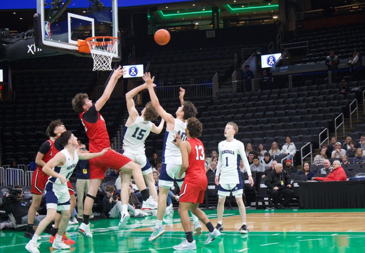 Milford fails to block a 2-point shot from  Hamilton-Wenham 