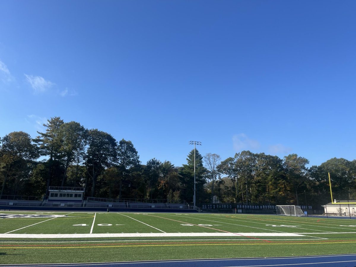 Clear view of the span of the home team bleachers on the stadium field.