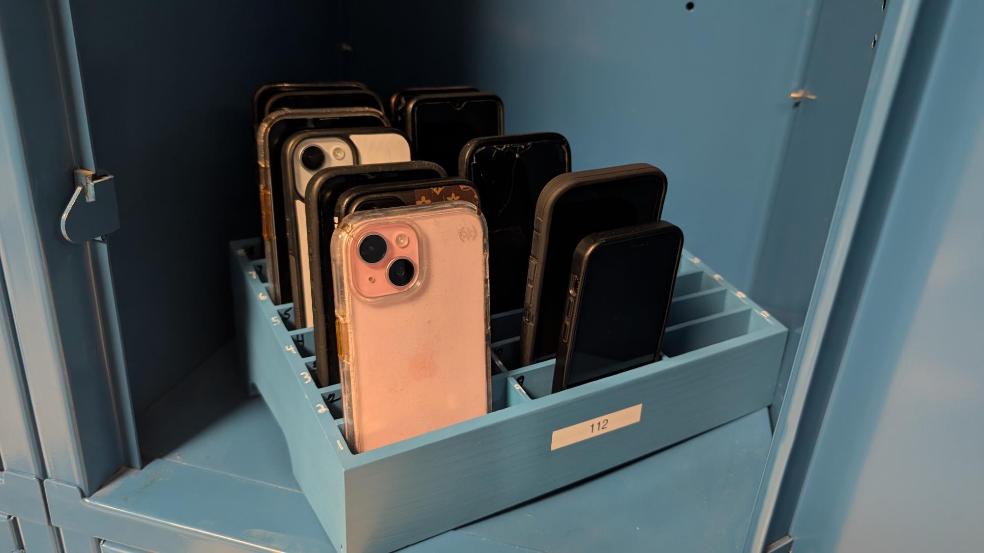 Phone are now kept in a box in a locker until the end of the day. 