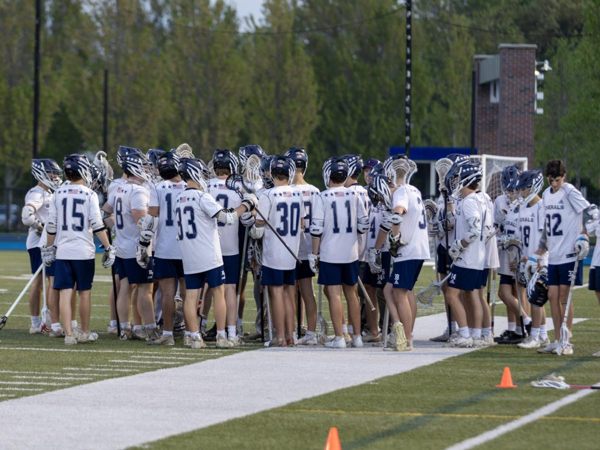 The 2024-2025 HW boys lacrosse team gathers in a huddle. Laselva hopes to build on these numbers for the 2026 season.