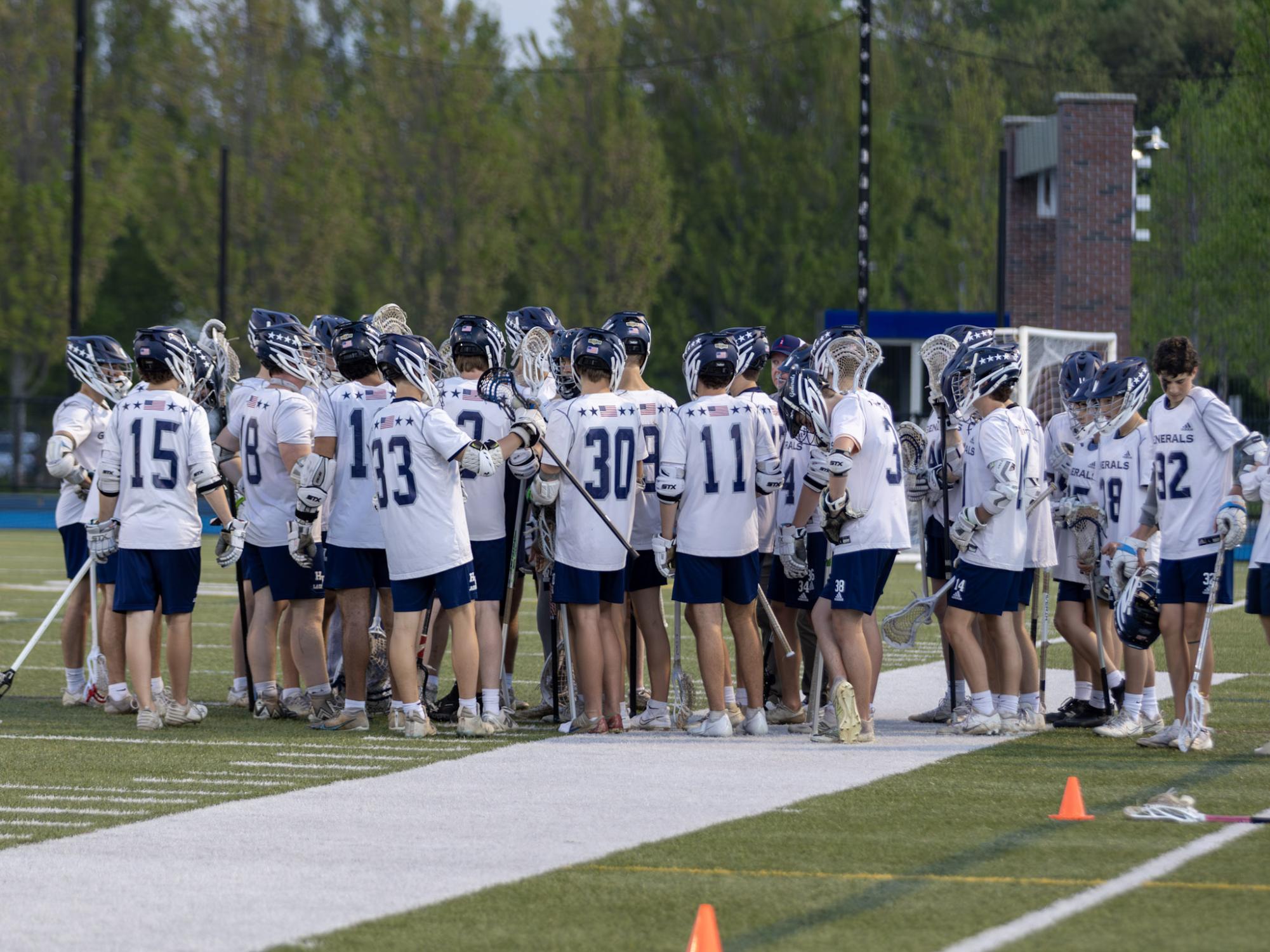 The 2024-2025 HW boys lacrosse team gathers in a huddle. Laselva hopes to build on these numbers for the 2026 season.