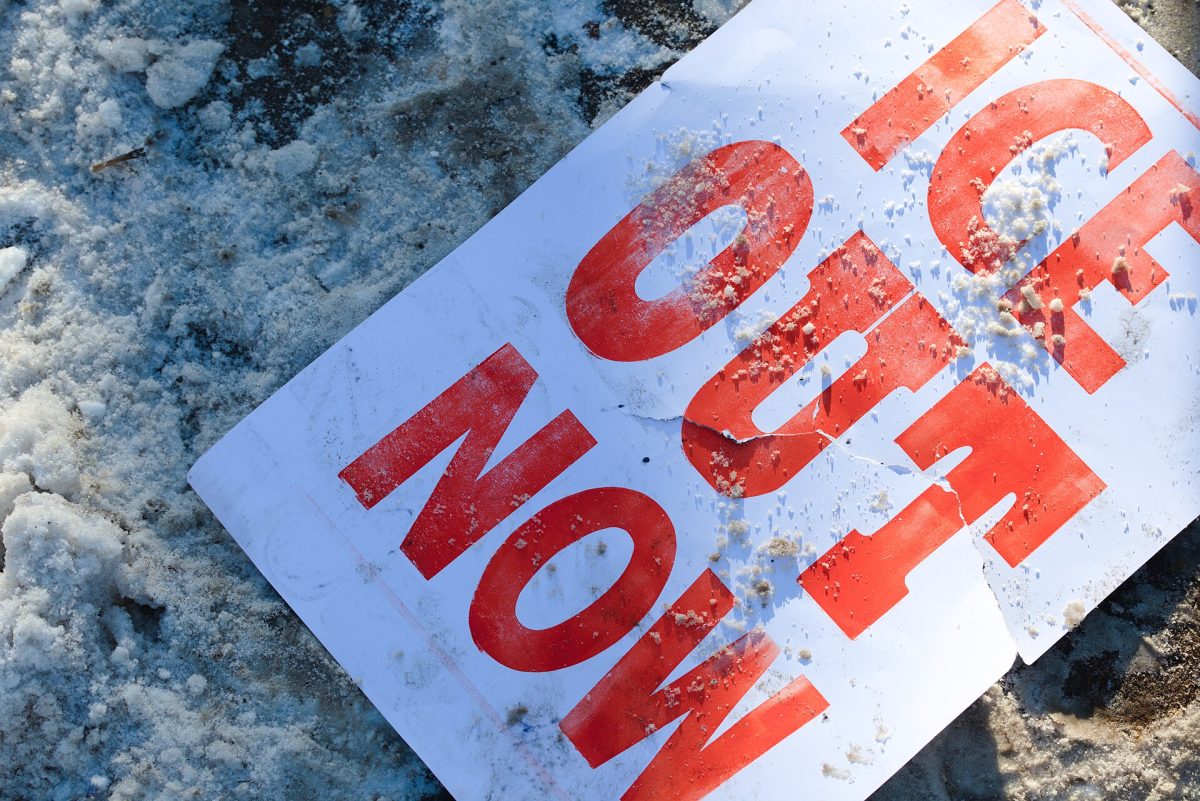 Photo of protesters sign in down town Minneapolis from January of 2026