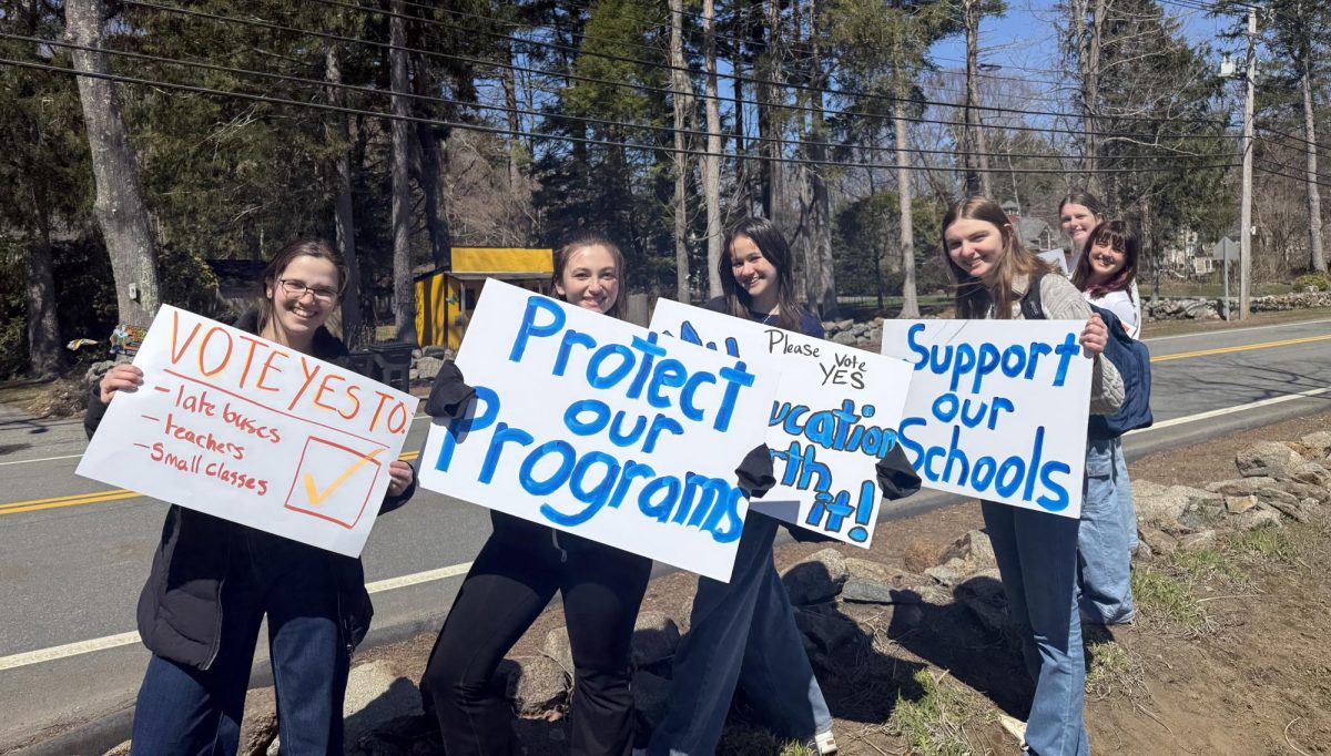 High School students picket in support of the override in the early morning before school starts. 